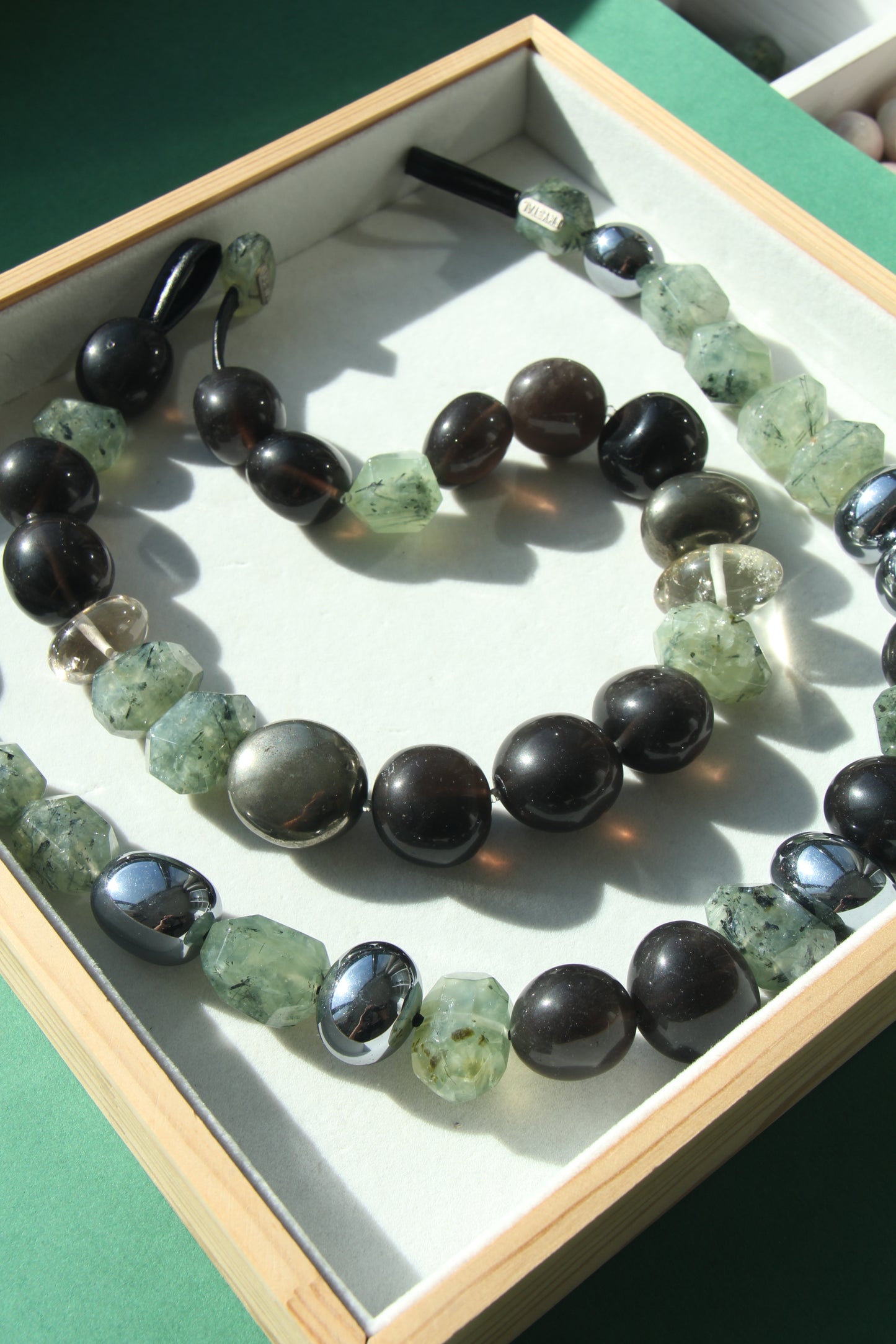 Necklace: prehnite, titanium magnet, obsidian