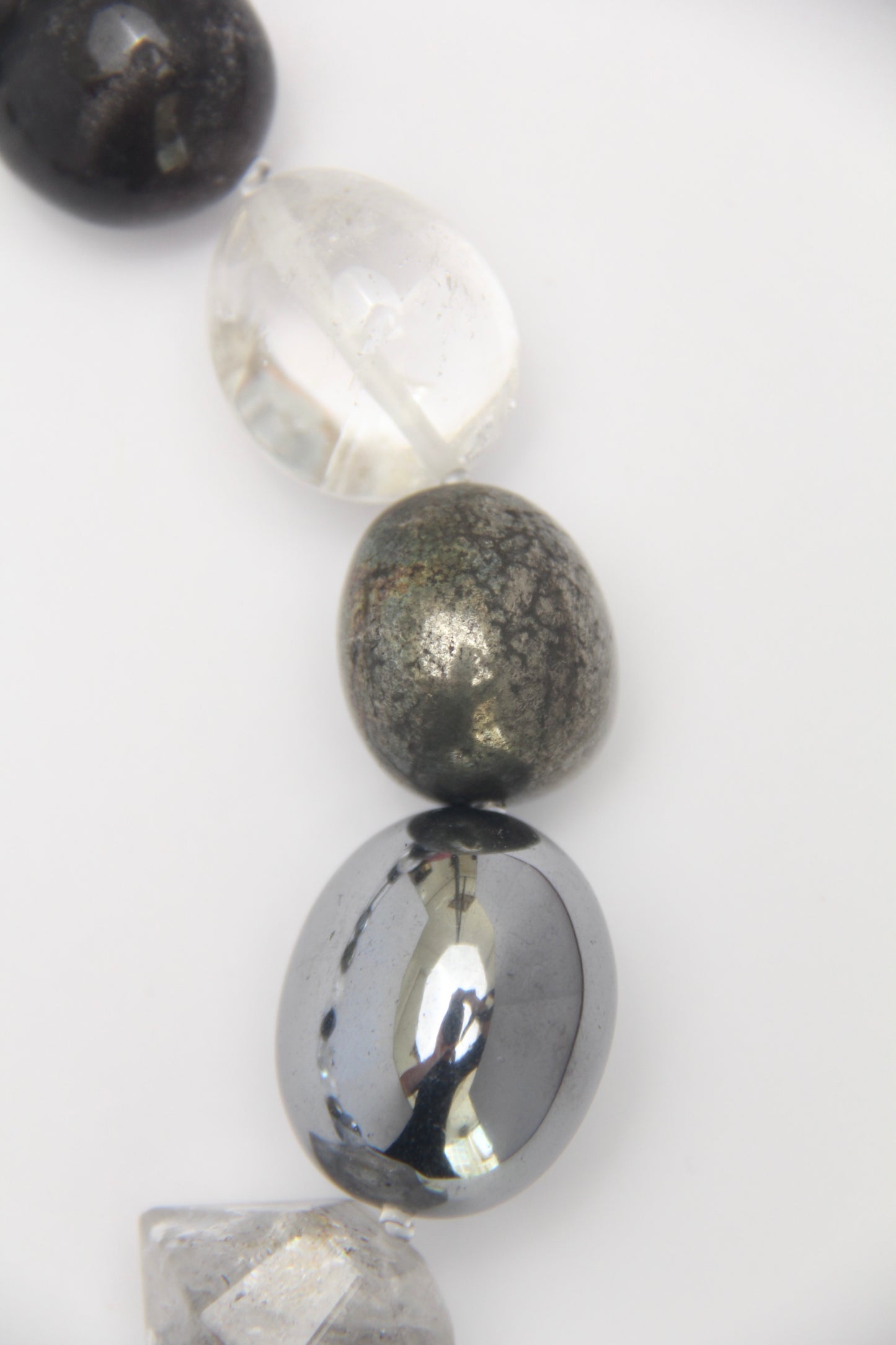 Necklace: quartz, obsidian, chalcopyrite, titanium magnet, herkimer diamond