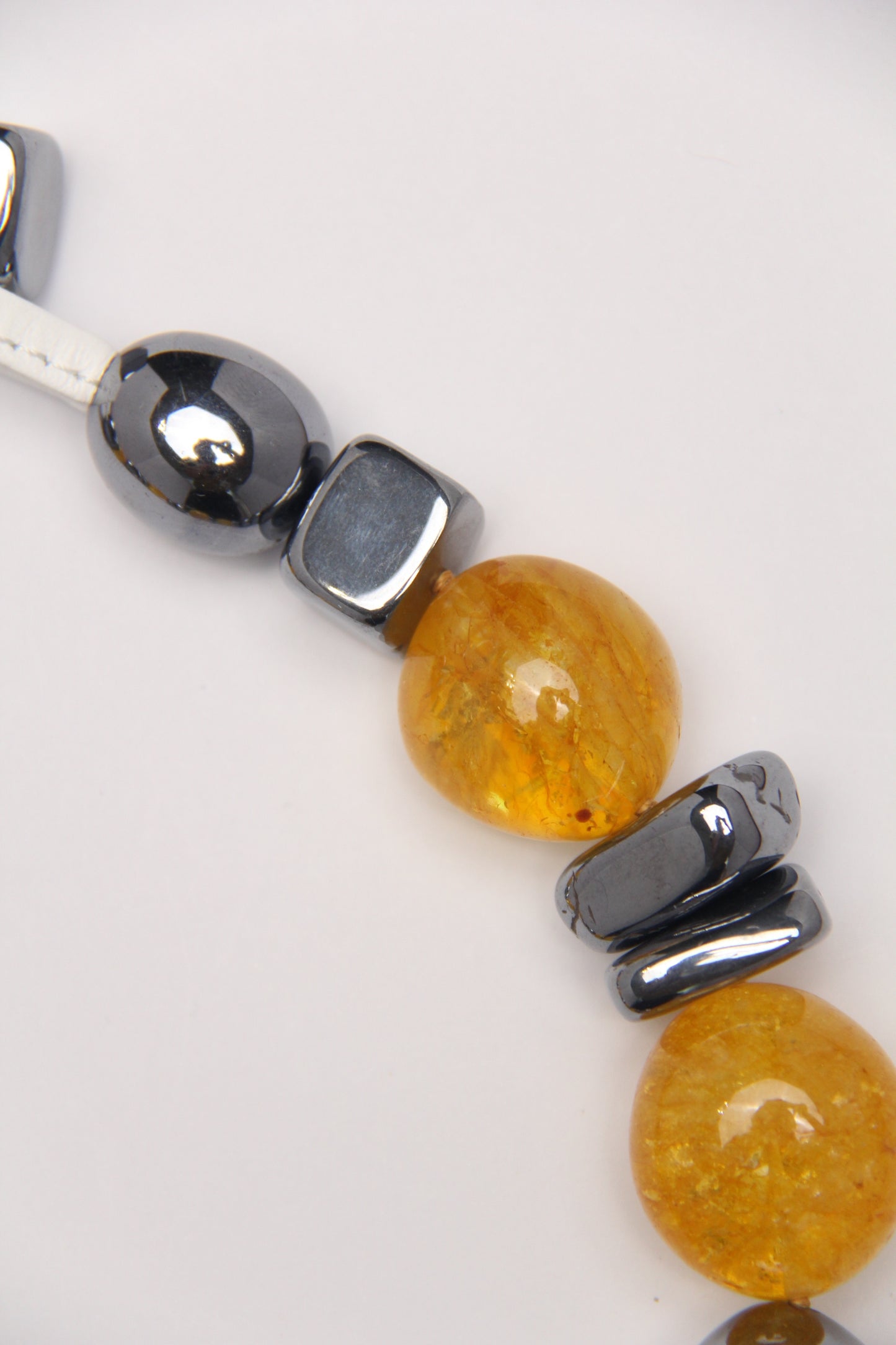 Necklace: titanium magnet, colored hematoid quartz