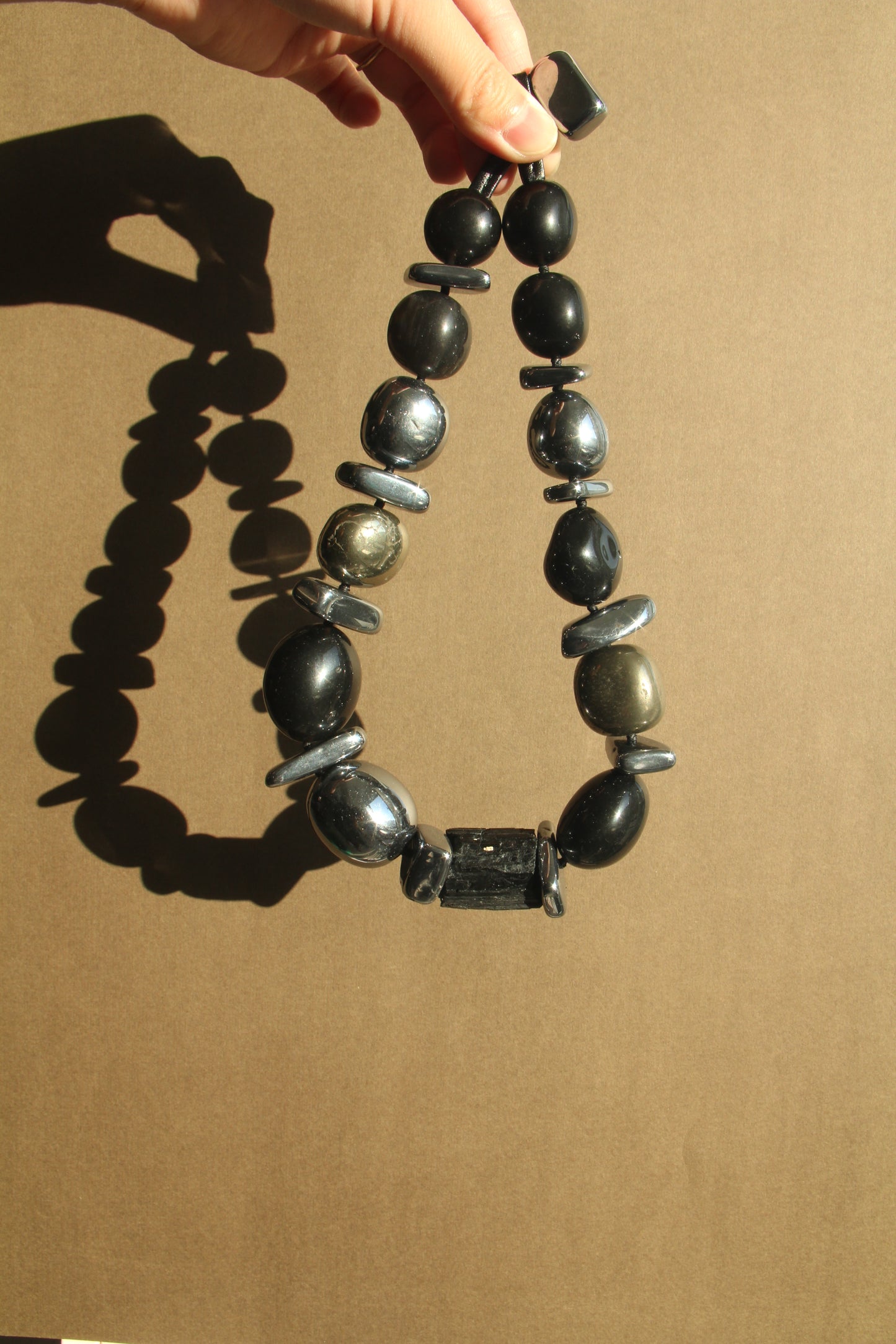 Necklace: black tourmaline, obsidian, chalcopyrite, titanium magnet