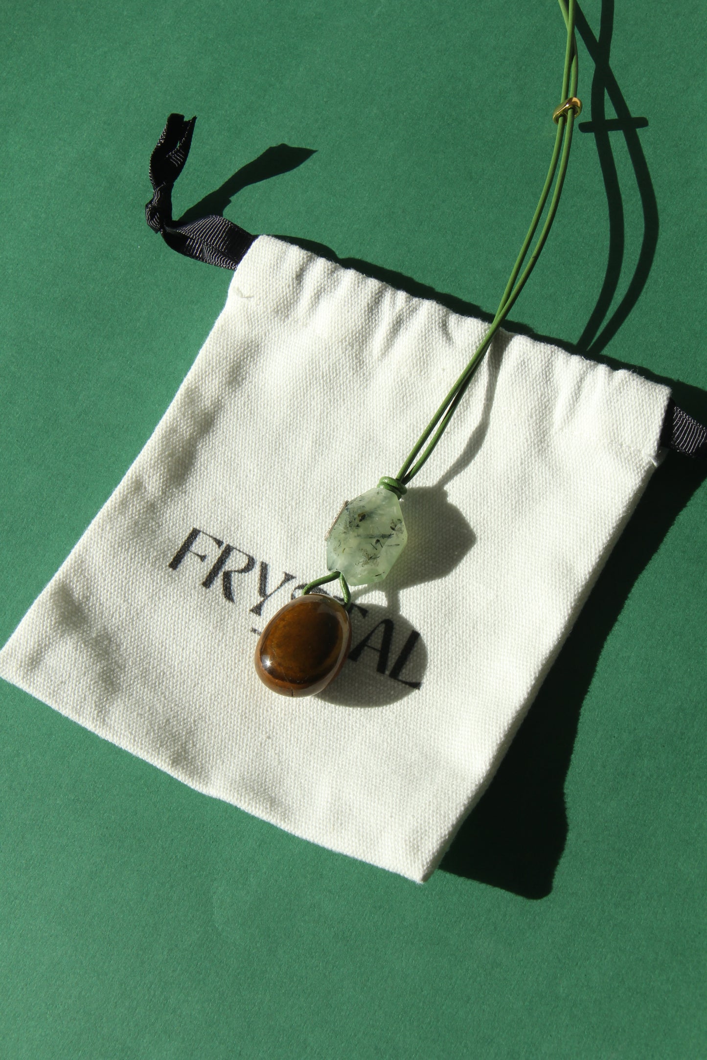 Pendant: prehnite, tiger's eye stone